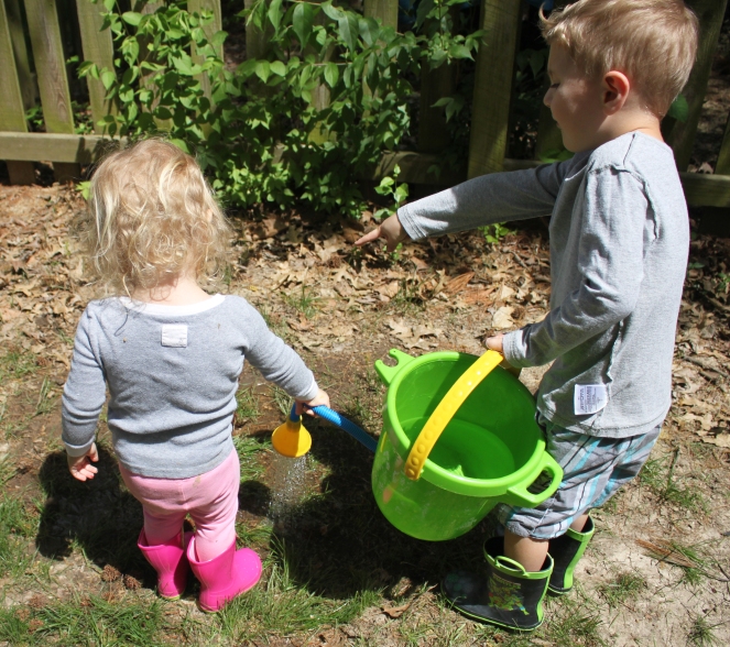kids watering plants
